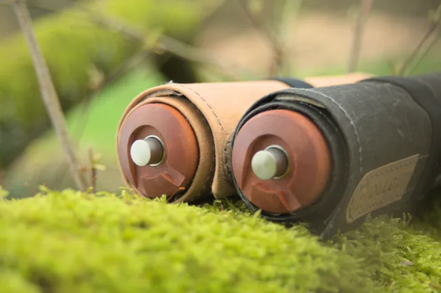 Detail shot of two Rollgut made from Pear wood. Left one wrapped with natural Color, right one wrapped with Granite color