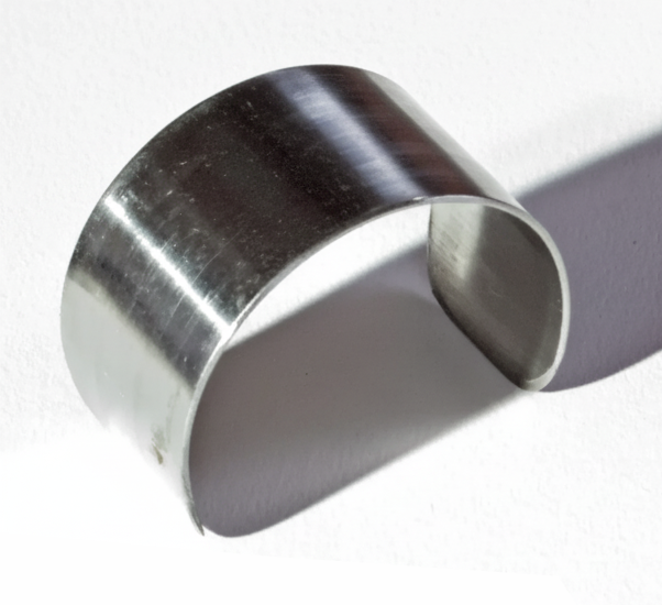 A metal clamping ring used to secure the pencilbox of a Rollgut Nova 